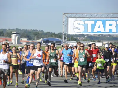 Crowd of participants running on the YKF runway