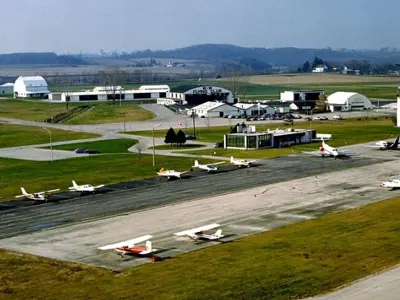 Aerial view of first air terminal building. Small aircrafts parked on apron